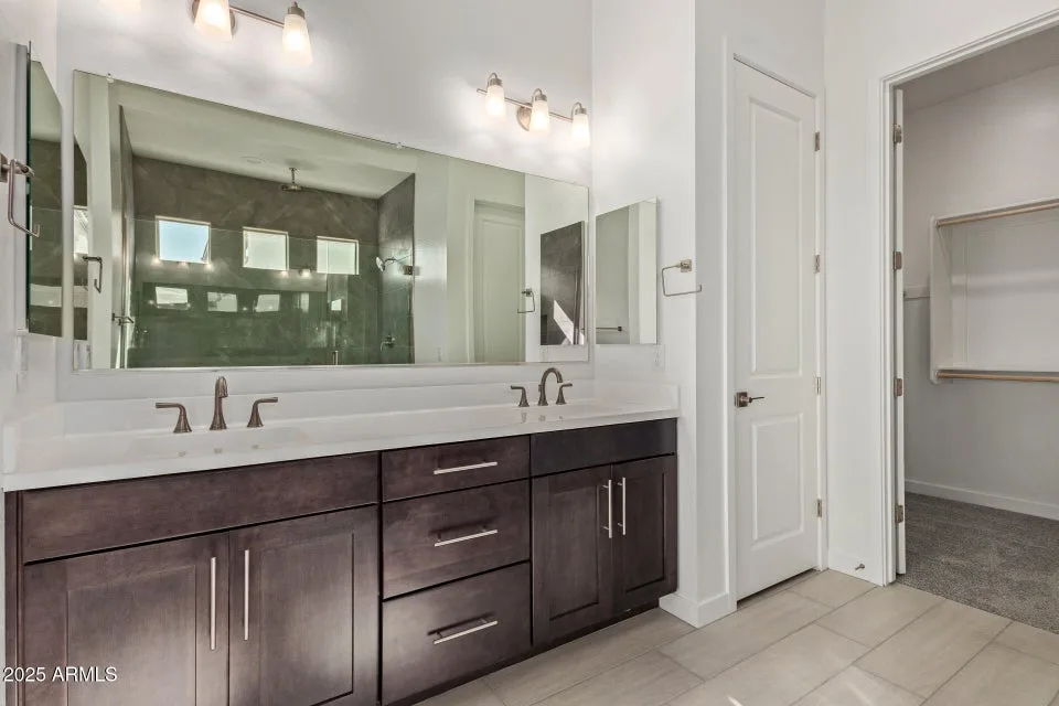 Bathroom with dark brown cabinets